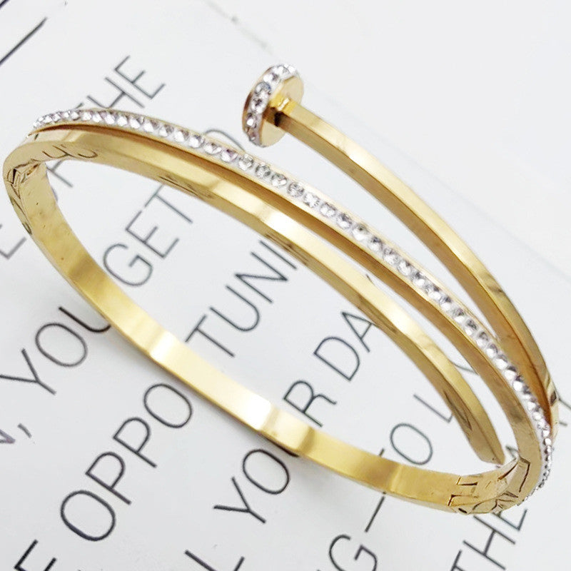 Jewels Galaxy Stainless Steel American Diamond Studded Nail Anti-Tarnish Bracelet For Women