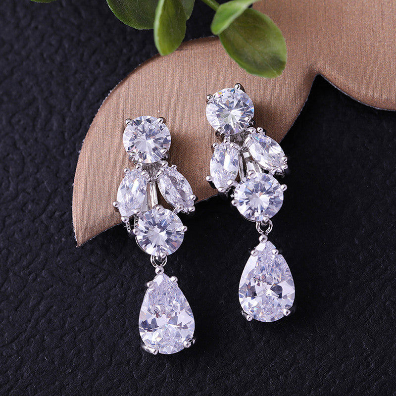 Jewels Galaxy Silver Plated AD Studded Contemporary Crushed Ice Cut Drop Earrings