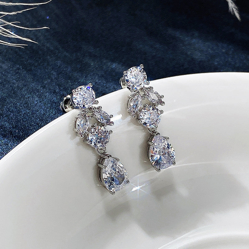 Jewels Galaxy Silver Plated AD Studded Contemporary Crushed Ice Cut Drop Earrings