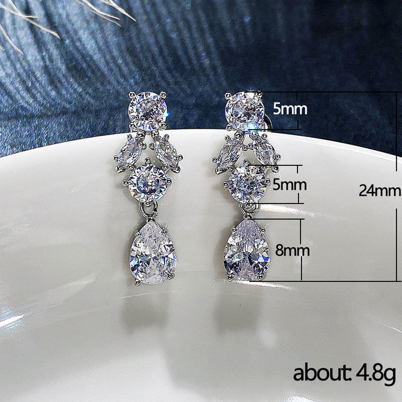 Jewels Galaxy Silver Plated AD Studded Contemporary Crushed Ice Cut Drop Earrings