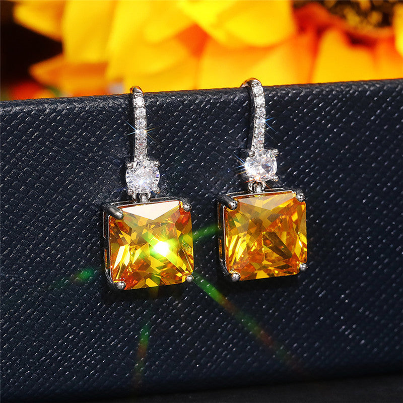 Jewels Galaxy Silver Plated AD Studded Yellow Square Shape Crushed Ice Cut Hanging Earrings