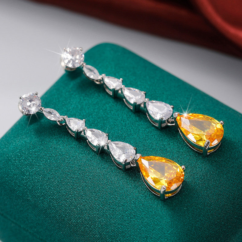 Jewels Galaxy Silver Plated AD Studded Yellow Teardrop Shape Crushed Ice Cut Drop Earrings