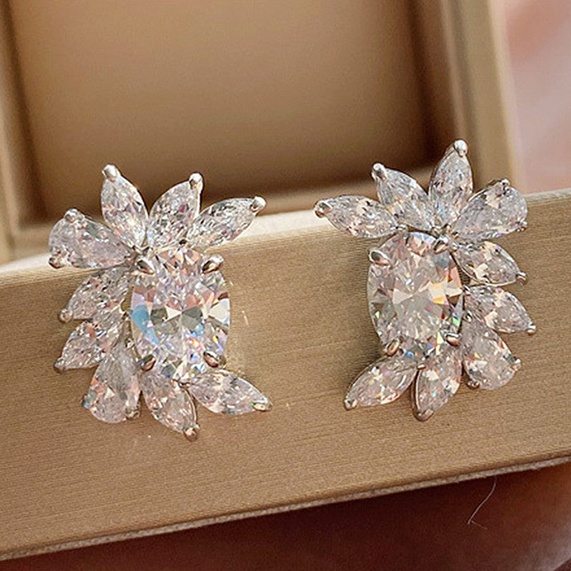 Jewels Galaxy Silver Plated American Diamond Studded Crushed Ice Cut Stud Earrings