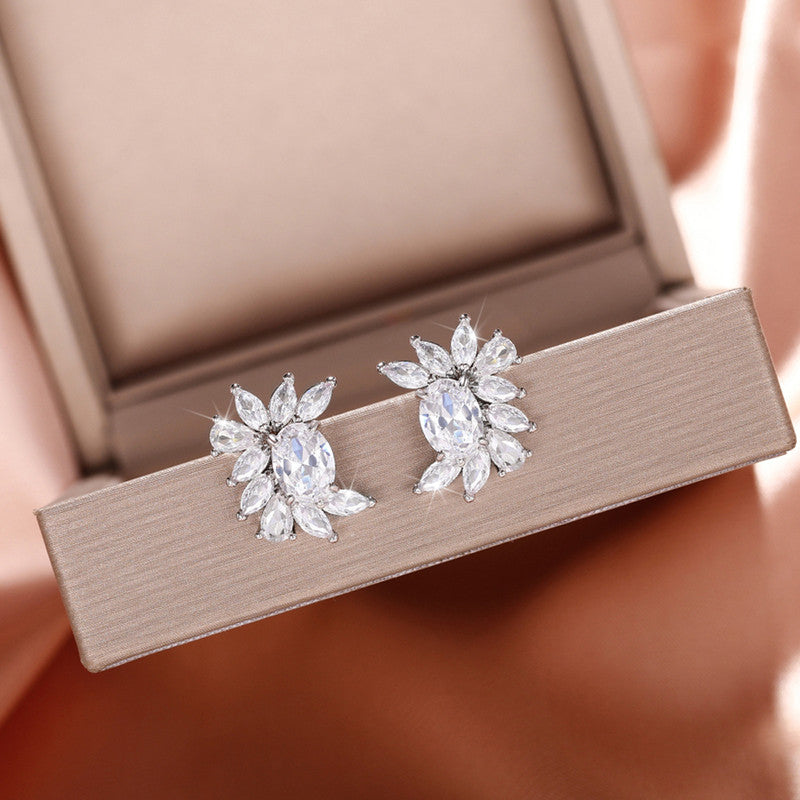 Jewels Galaxy Silver Plated American Diamond Studded Crushed Ice Cut Stud Earrings