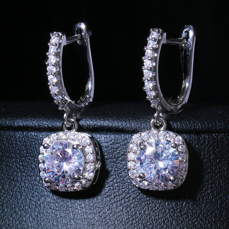 Jewels Galaxy Silver Plated American Diamond Studded Rectangular Crushed Ice Cut Drop Earrings