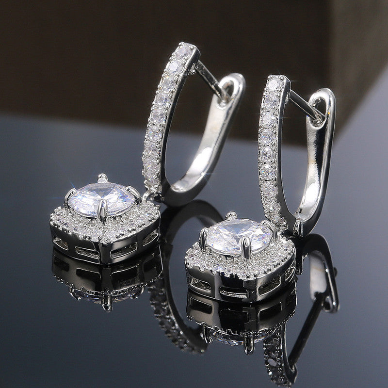 Jewels Galaxy Silver Plated American Diamond Studded Rectangular Crushed Ice Cut Drop Earrings