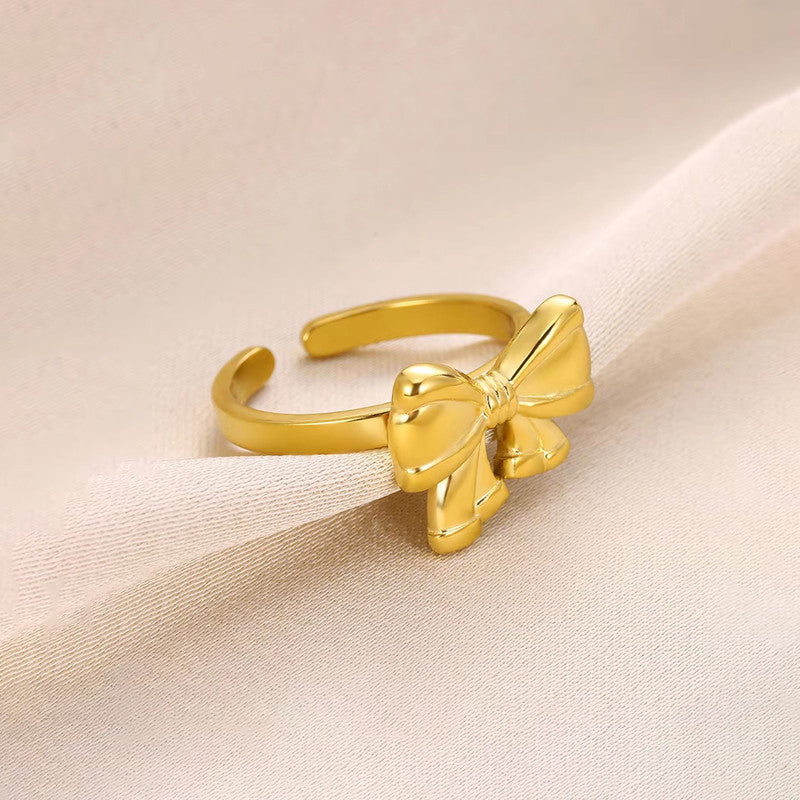 Jewels Galaxy Gold Plated Stainless Steel Anti Tarnish Bow Themed Adjustable Finger Ring For Women