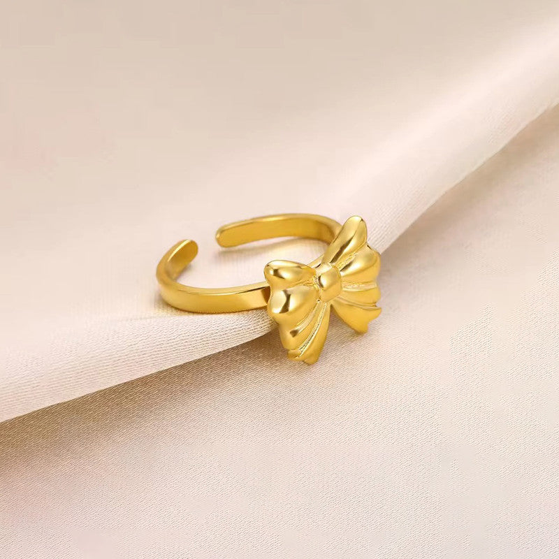 Jewels Galaxy Gold Plated Stainless Steel Anti Tarnish Bow Themed Adjustable Finger Ring For Women