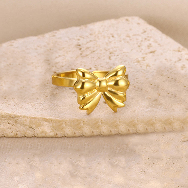 Jewels Galaxy Gold Plated Stainless Steel Anti Tarnish Bow Themed Adjustable Finger Ring For Women