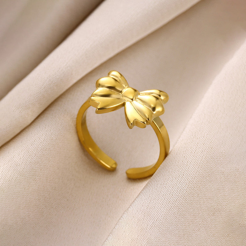 Jewels Galaxy Gold Plated Stainless Steel Anti Tarnish Bow Themed Adjustable Finger Ring For Women