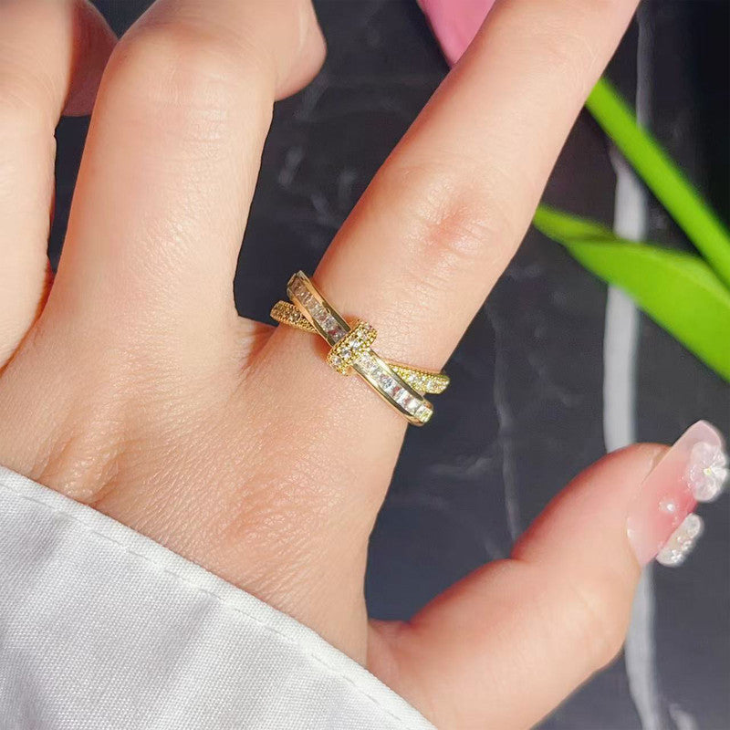 Jewels Galaxy Gold Plated Anti Tarnish Stainless Steel Cross Shaped Adjustable Finger Ring