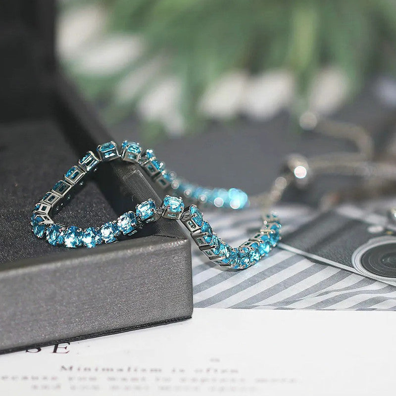 Jewels Galaxy Silver Plated Round Cut Cubic Zirconia Blue Matrix Anti Tarnish Tennis Bracelet