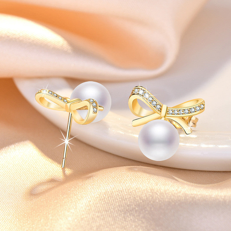 Jewels Galaxy Gold Plated American Diamond Studded Bow-Tie Shape Korean Stud Earrings