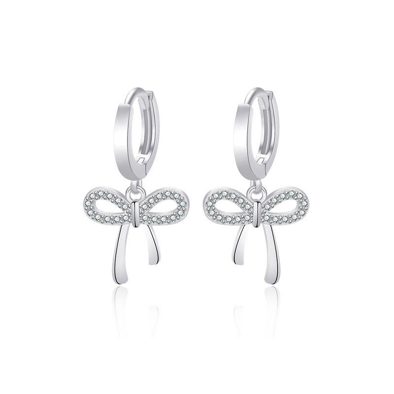 Jewels Galaxy Silver Plated American Diamond Studded Bow-Tie Shape Korean Stud Earrings