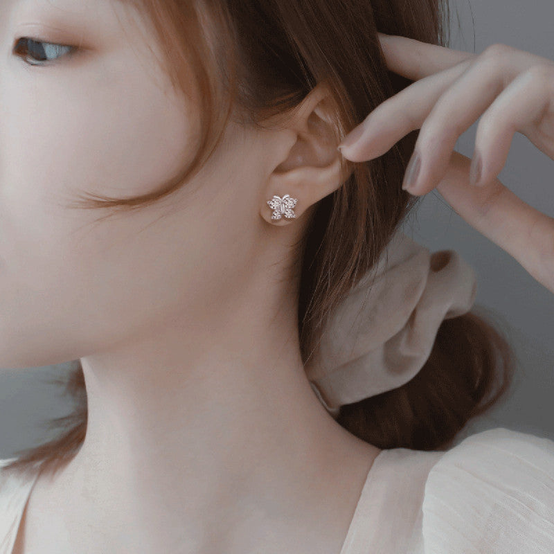 Jewels Galaxy Silver Plated American Diamond Studded Butterfly Shape Korean Hoop Earrings
