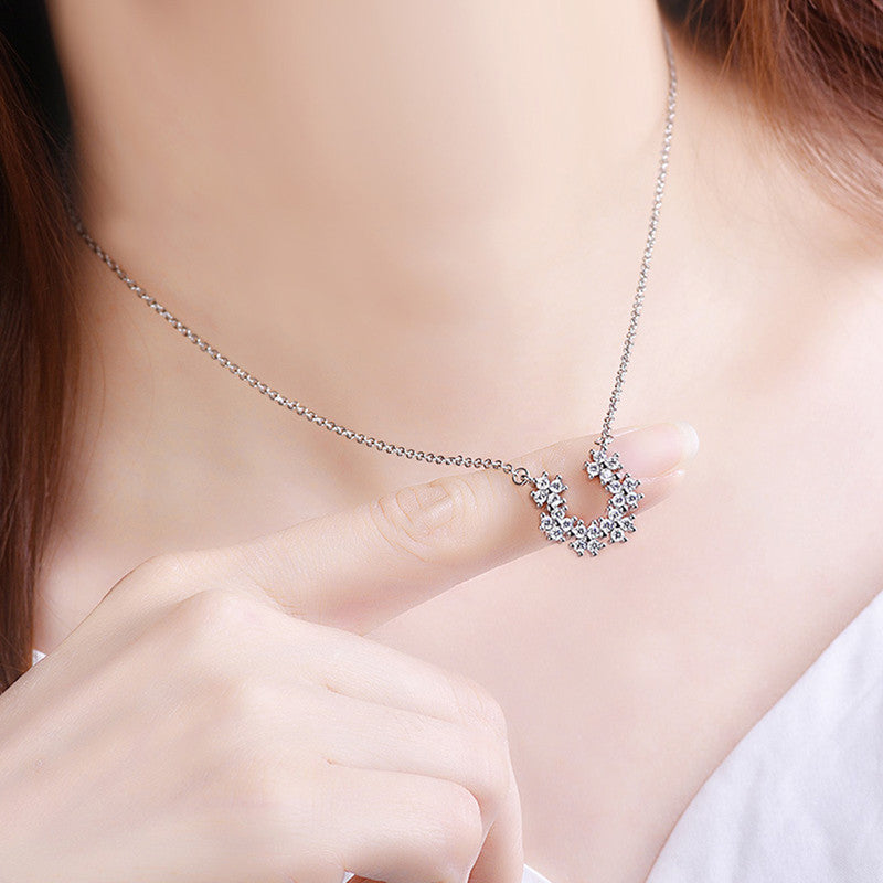 Jewels Galaxy Silver Plated American Diamond Studded Half Hoop Floral Pendant