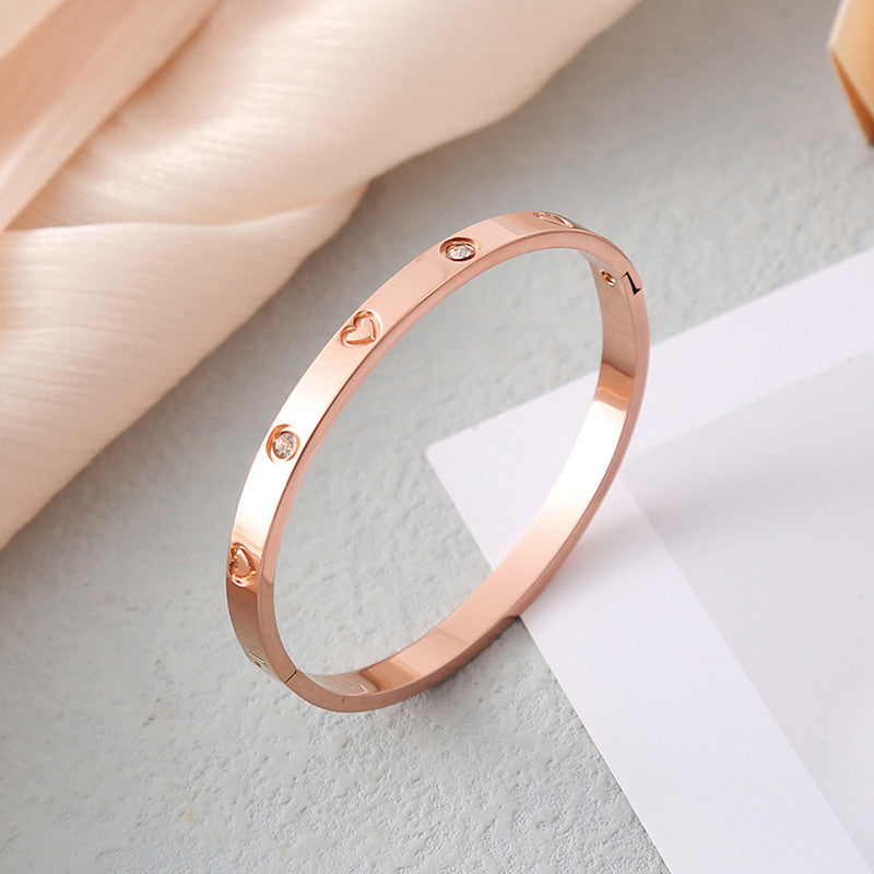 Jewels Galaxy Stainless Steel Astonishing Rose Gold Plated Love AD Bracelet For Women