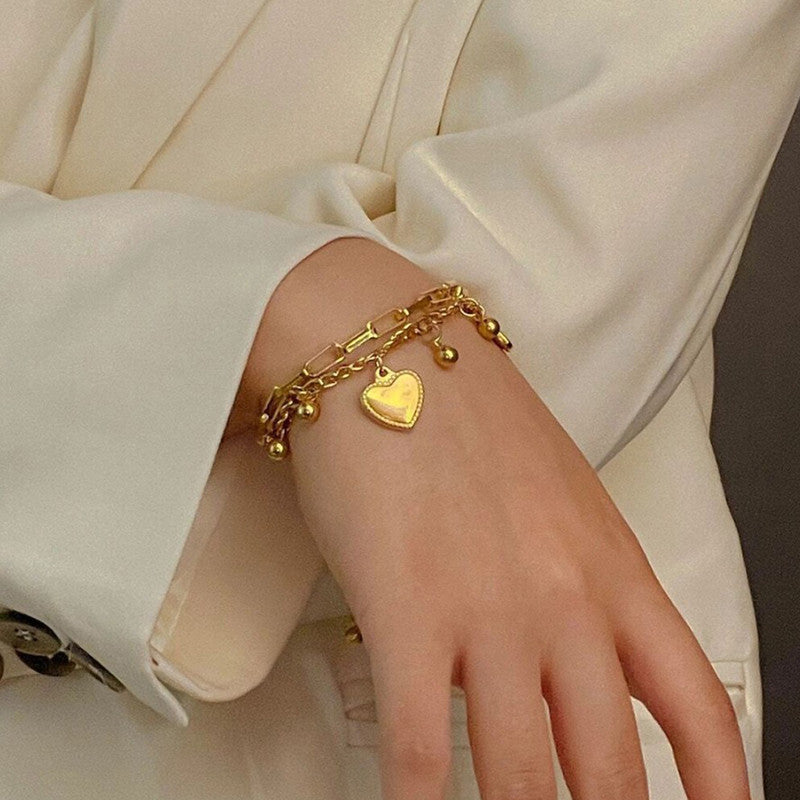 Jewels Galaxy Gold Plated Stainless Steel Anti Tarnish Heart themed Wraparound Bracelet For Women