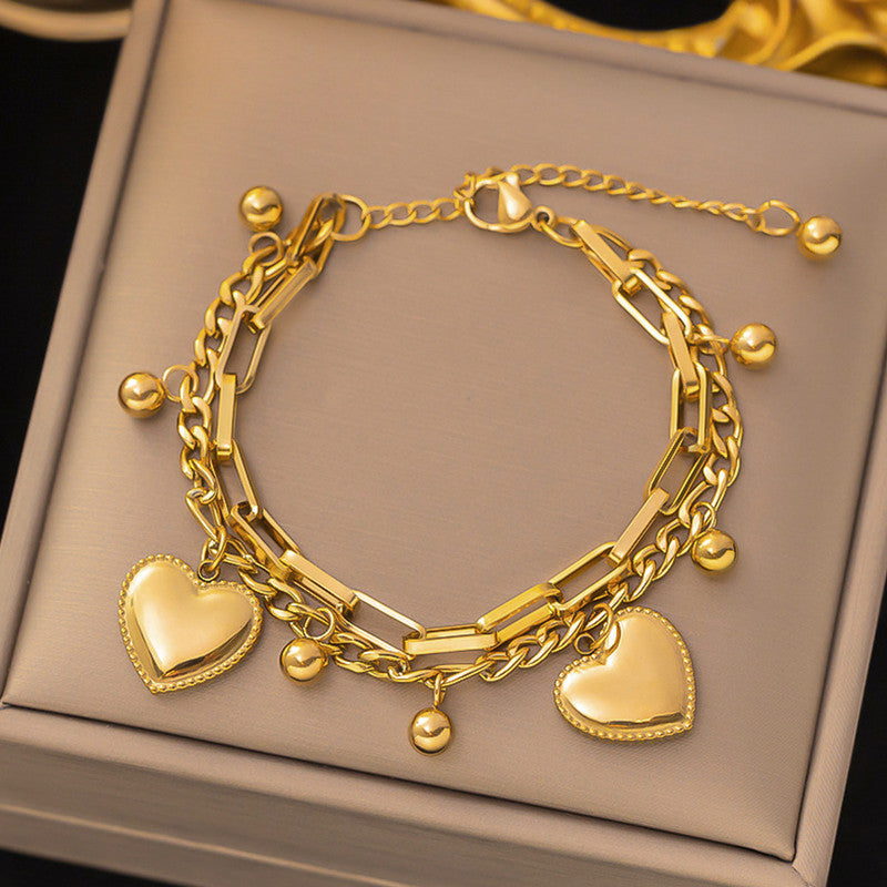 Jewels Galaxy Gold Plated Stainless Steel Anti Tarnish Heart themed Wraparound Bracelet For Women