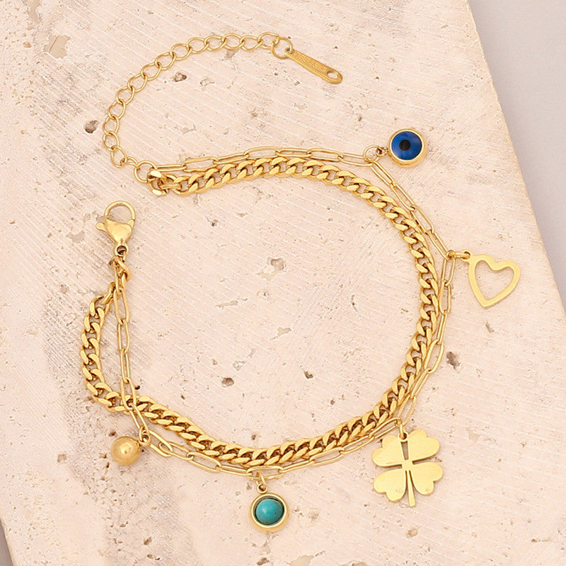 Jewels Galaxy Gold Plated Stainless Steel Anti Tarnish Clover themed Evil Eye Wraparound Bracelet