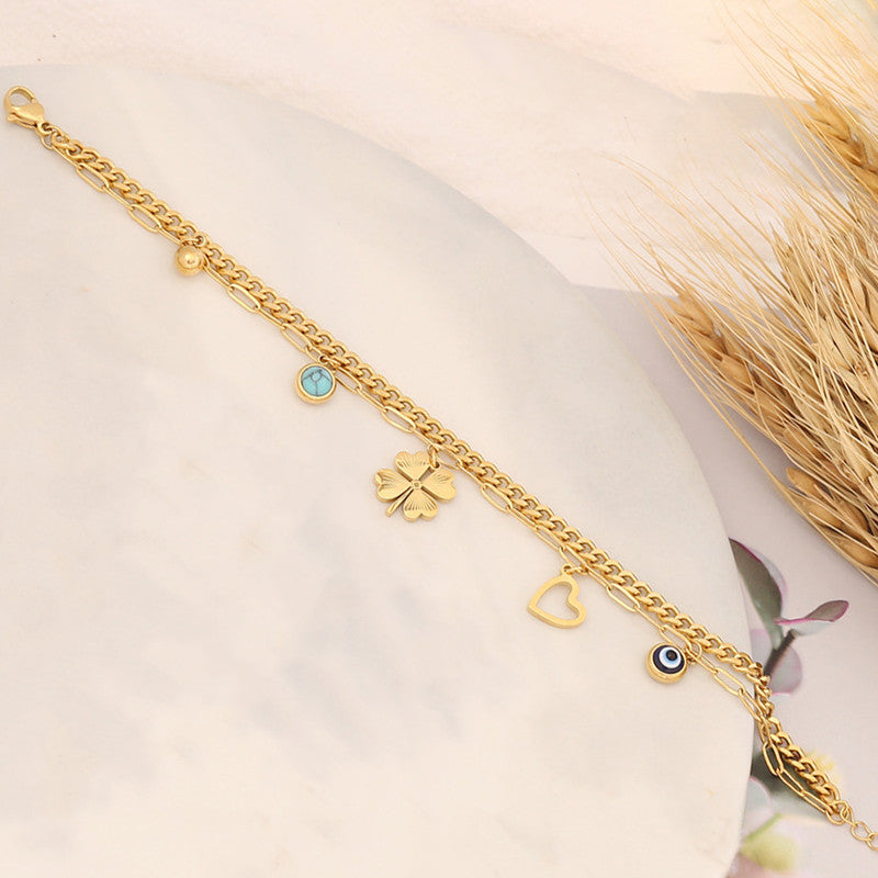 Jewels Galaxy Gold Plated Stainless Steel Anti Tarnish Clover themed Evil Eye Wraparound Bracelet