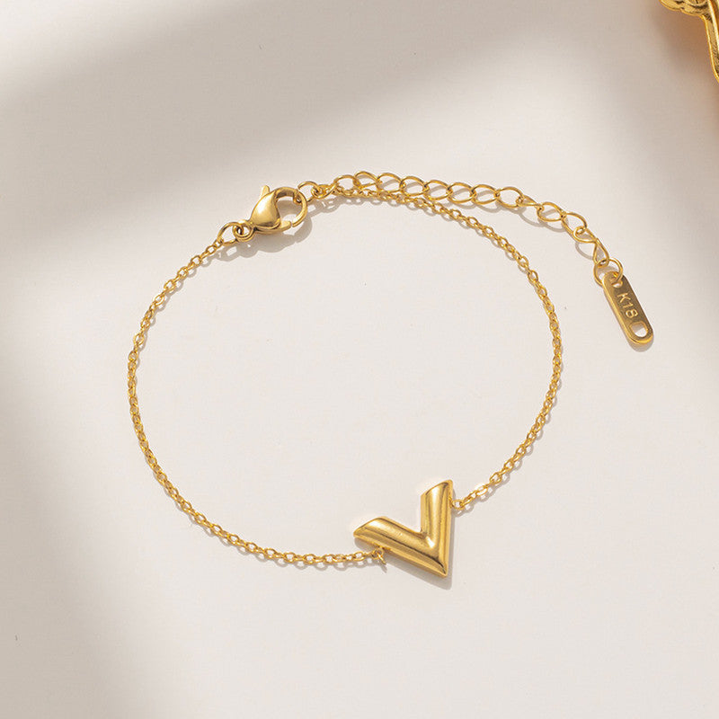 Jewels Galaxy Gold Plated Stainless Steel Anti Tarnish V-Shaped Wraparound Bracelet For Women