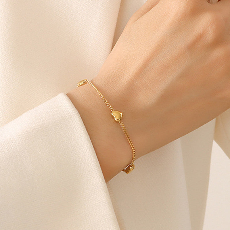 Jewels Galaxy Gold Plated Stainless Steel Anti Tarnish Heart themed Wraparound Bracelet For Women