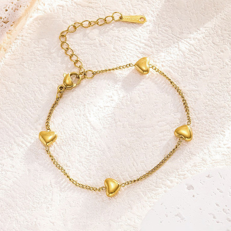 Jewels Galaxy Gold Plated Stainless Steel Anti Tarnish Heart themed Wraparound Bracelet For Women