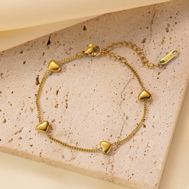 Jewels Galaxy Gold Plated Stainless Steel Anti Tarnish Heart themed Wraparound Bracelet For Women
