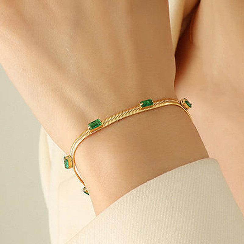 Jewels Galaxy Gold Plated Stainless Steel Anti Tarnish Snake Chain Green Emerald Studded Bracelet