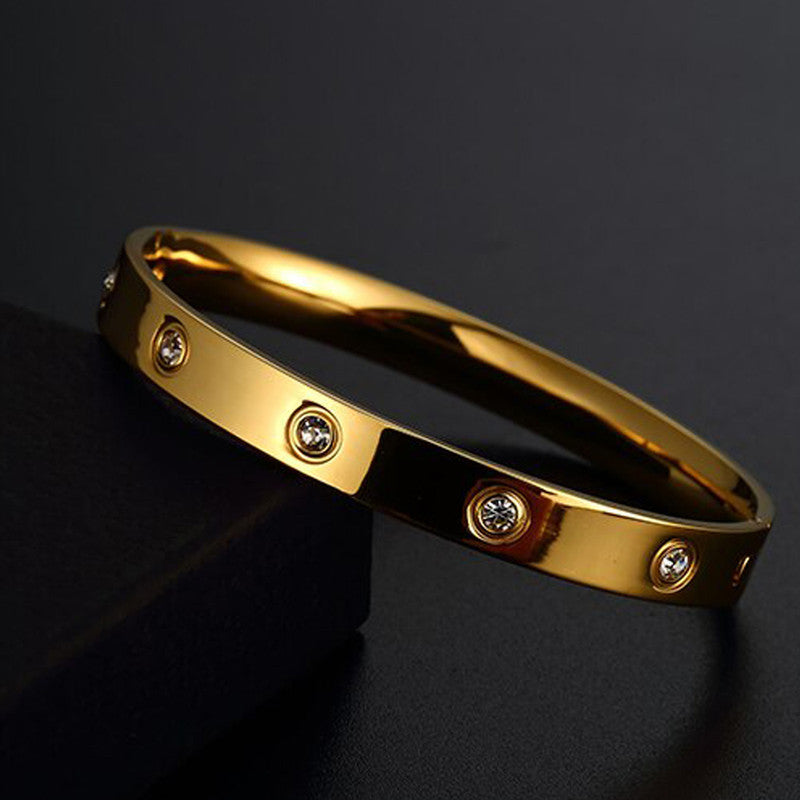 Jewels Galaxy Stainless Steel Contemporary Gold Plated Love AD Anti-Tarnish Bracelet For Women