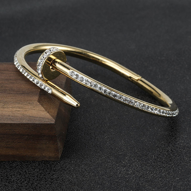 Jewels Galaxy Stainless Steel Anti Tarnish AD Studded Nail Bracelet For Women