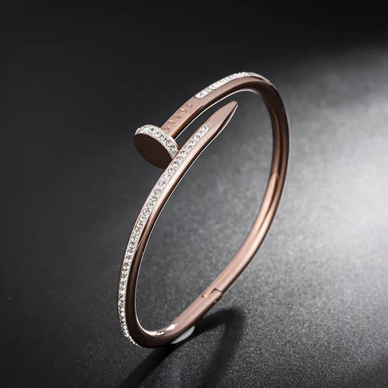 Jewels Galaxy Stainless Steel Anti Tarnish AD Studded Nail Bracelet For Women