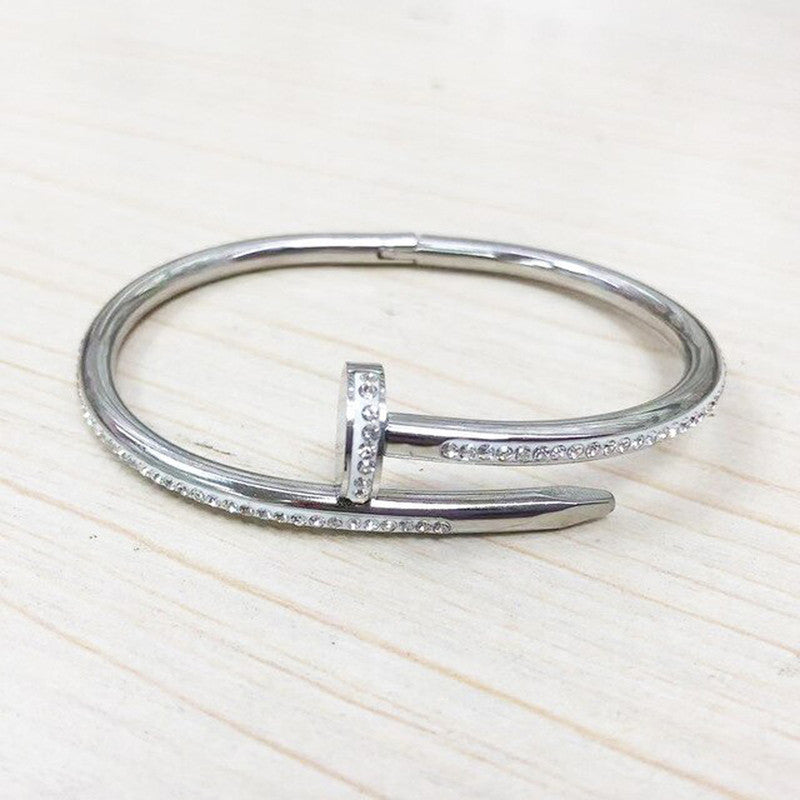 Jewels Galaxy Stainless Steel Anti Tarnish AD Studded Nail Bracelet For Women