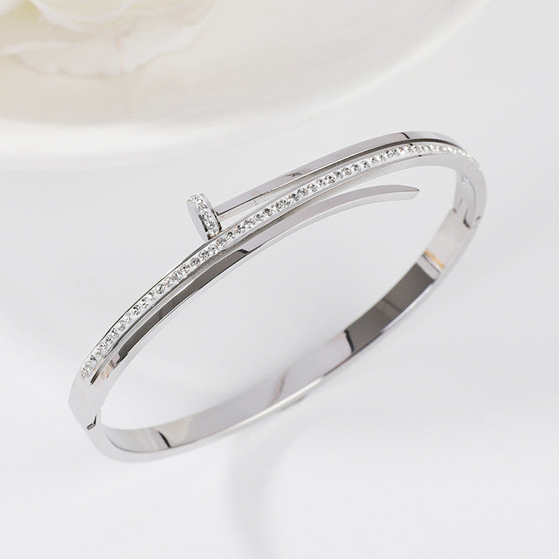 Jewels Galaxy Stainless Steel American Diamond Studded Nail Anti-Tarnish Bracelet For Women