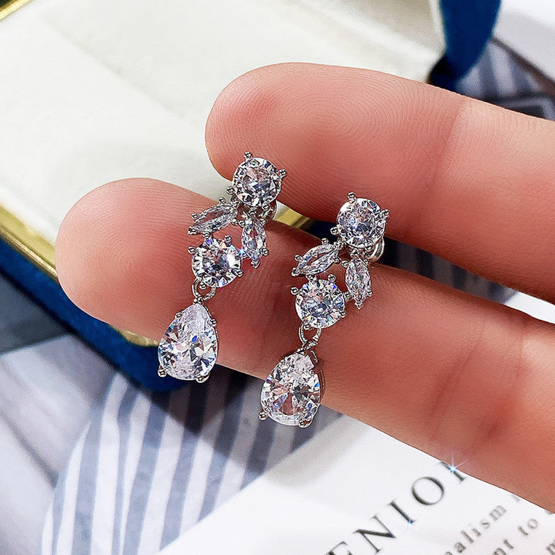 Jewels Galaxy Silver Plated AD Studded Contemporary Crushed Ice Cut Drop Earrings