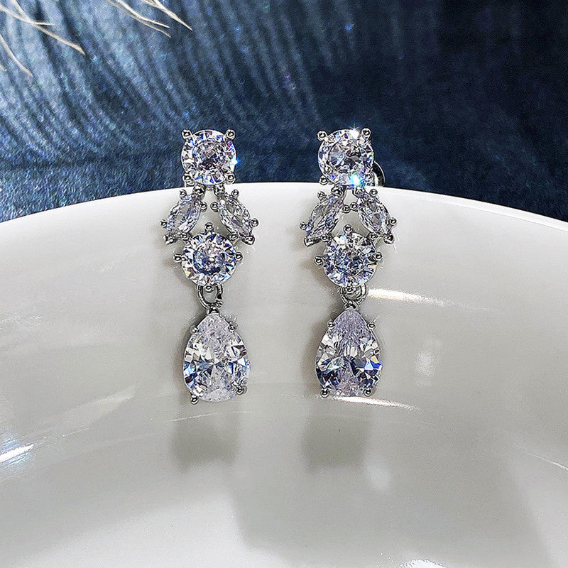 Jewels Galaxy Silver Plated AD Studded Contemporary Crushed Ice Cut Drop Earrings