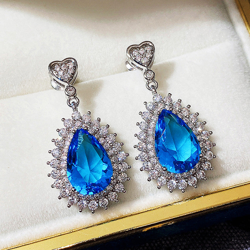 Jewels Galaxy Silver Plated American Diamond Studded Blue Teardop Shape Ice Cut Drop Earrings