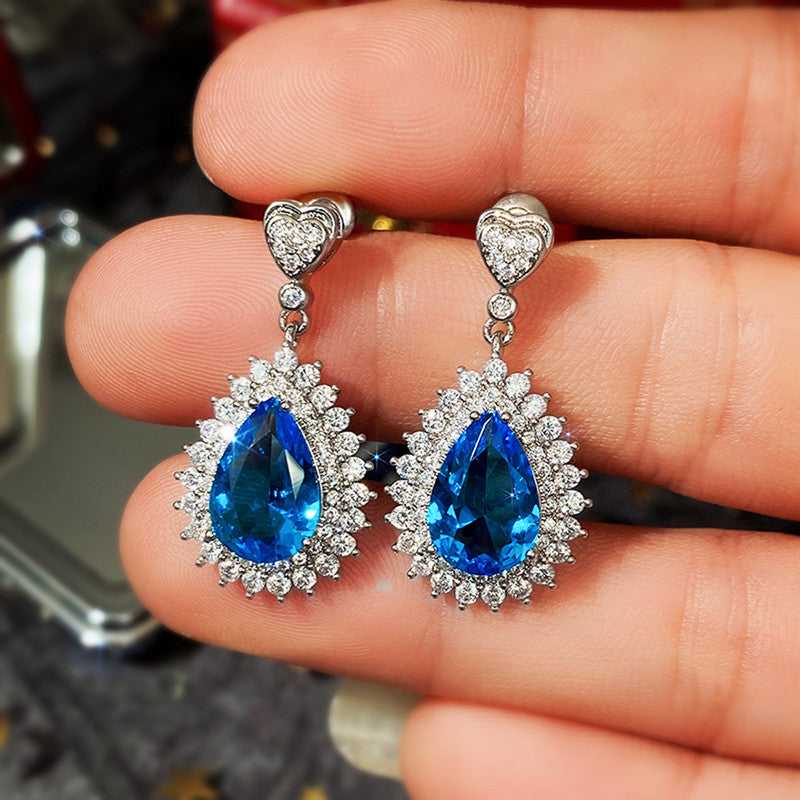 Jewels Galaxy Silver Plated American Diamond Studded Blue Teardop Shape Ice Cut Drop Earrings