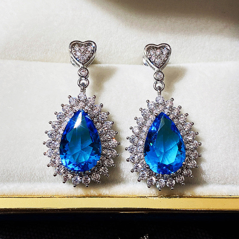 Jewels Galaxy Silver Plated American Diamond Studded Blue Teardop Shape Ice Cut Drop Earrings