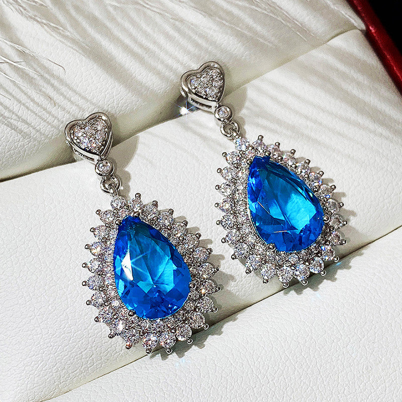 Jewels Galaxy Silver Plated American Diamond Studded Blue Teardop Shape Ice Cut Drop Earrings