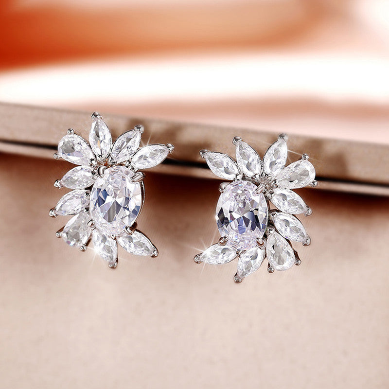 Jewels Galaxy Silver Plated American Diamond Studded Crushed Ice Cut Stud Earrings
