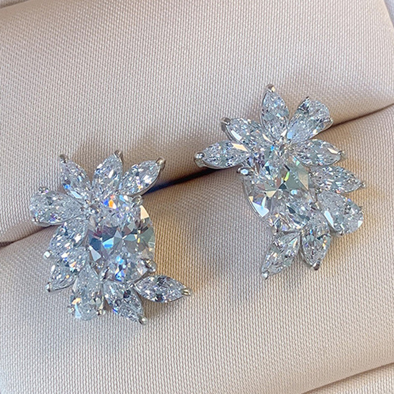 Jewels Galaxy Silver Plated American Diamond Studded Crushed Ice Cut Stud Earrings