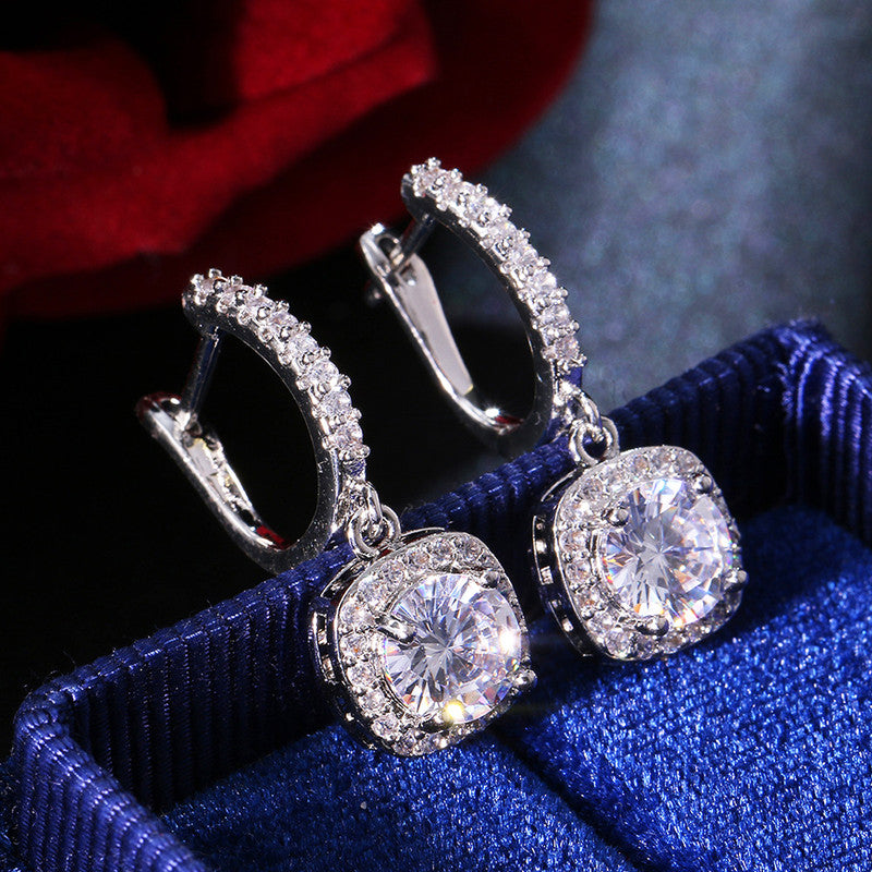 Jewels Galaxy Silver Plated American Diamond Studded Rectangular Crushed Ice Cut Drop Earrings