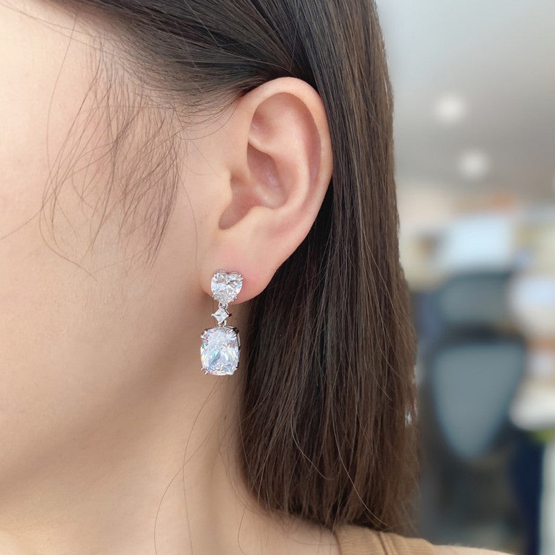 Jewels Galaxy Silver Plated AD Studded Silver Heart inspired Crushed Ice Cut Drop Earrings