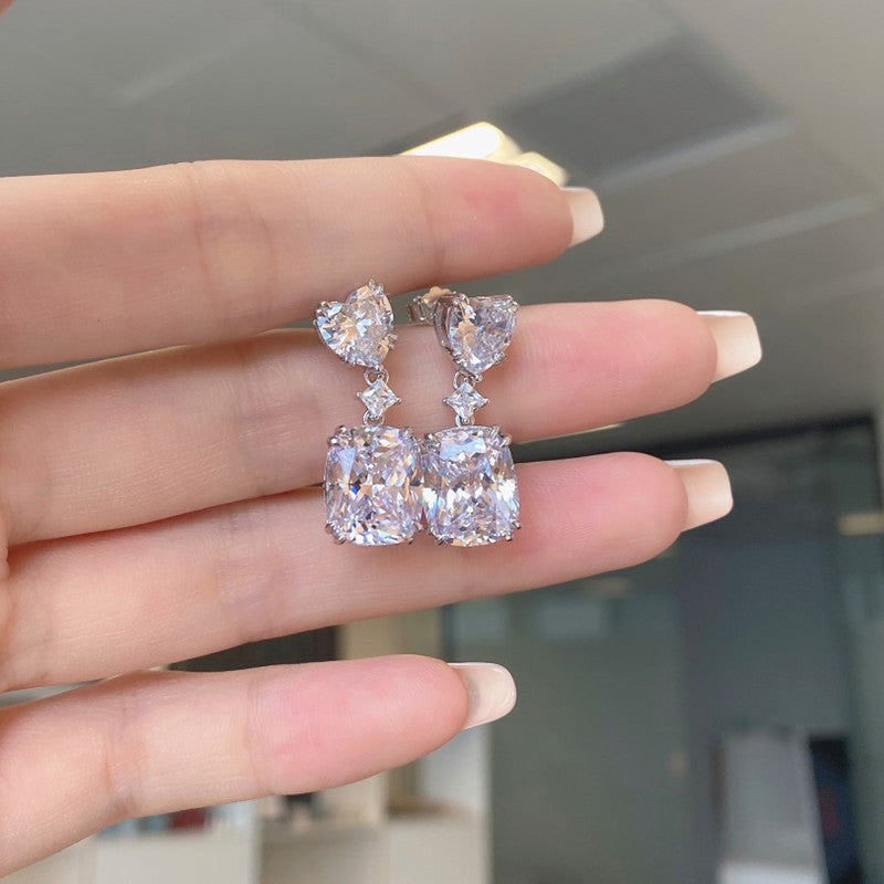 Jewels Galaxy Silver Plated AD Studded Silver Heart inspired Crushed Ice Cut Drop Earrings