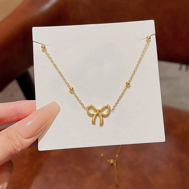 Jewels Galaxy Gold-Plated Anti Tarnish Infinity Bow Pendant