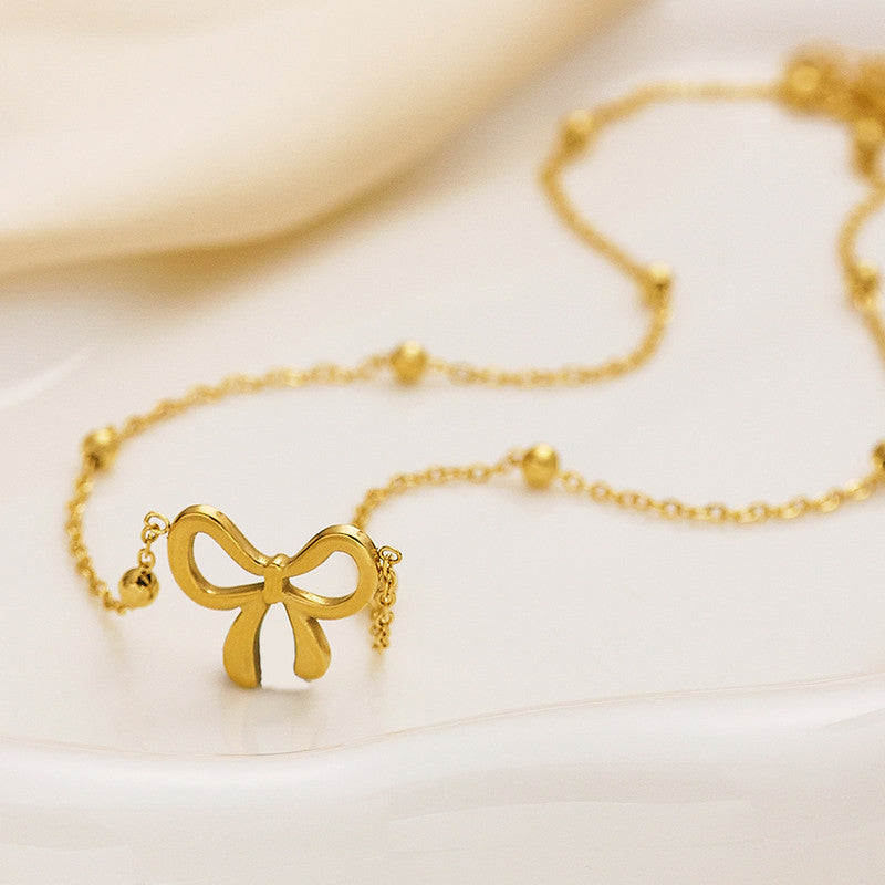 Jewels Galaxy Gold-Plated Anti Tarnish Infinity Bow Pendant