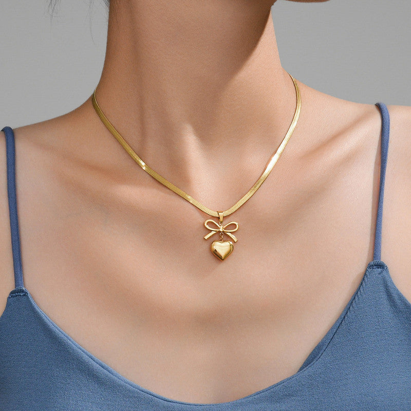 Jewels Galaxy Gold Plated Anti Tarnish Bow Knot Heart Themed Pendant