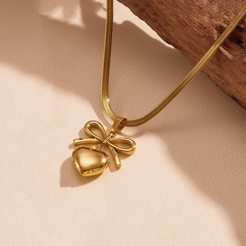Jewels Galaxy Gold Plated Anti Tarnish Bow Knot Heart Themed Pendant